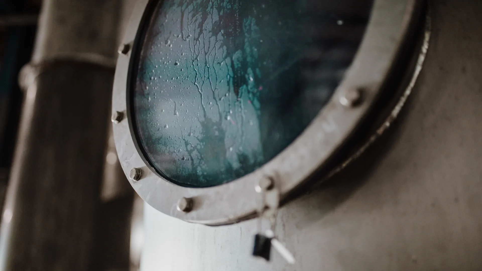 Inspection window on an industrial filtration system used in salt processing.